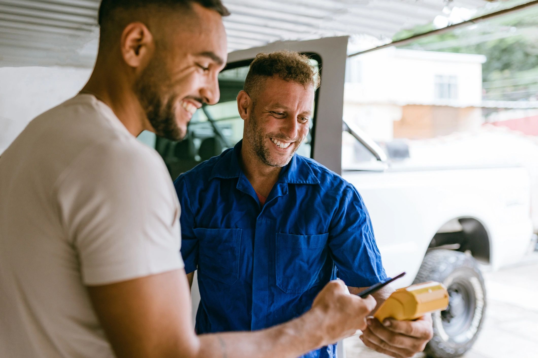 Customer paying at an auto repair shop counter
