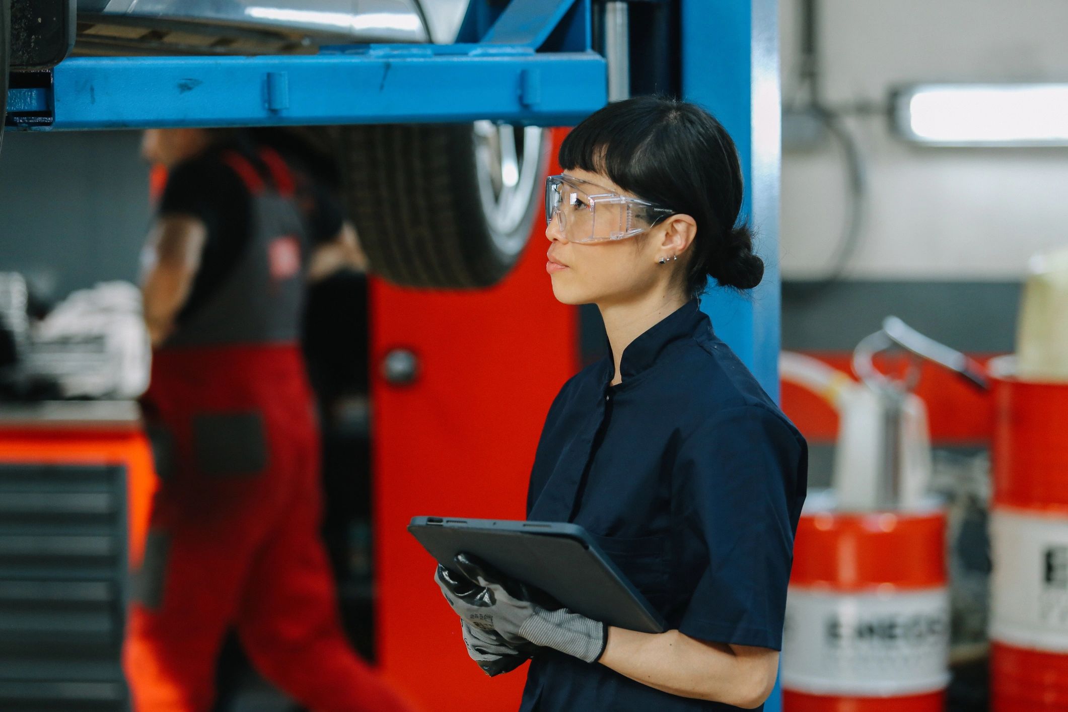 Vehicle maintenance being performed in a repair shop